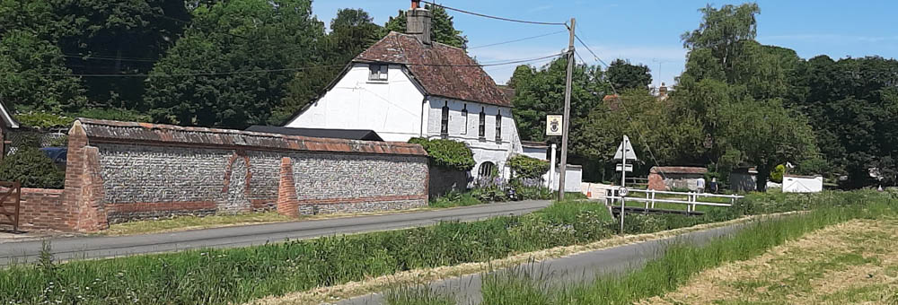 Newton Toney Wiltshire village image of the River Bourne and pub